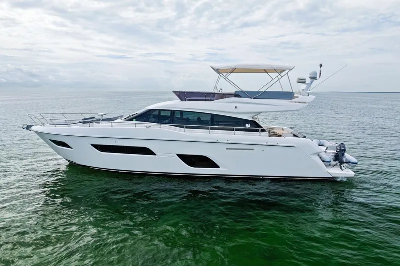 Slide: The Image of Luxurious 2018 Ferretti Yachts 550 cruising on clear green waters. - 5