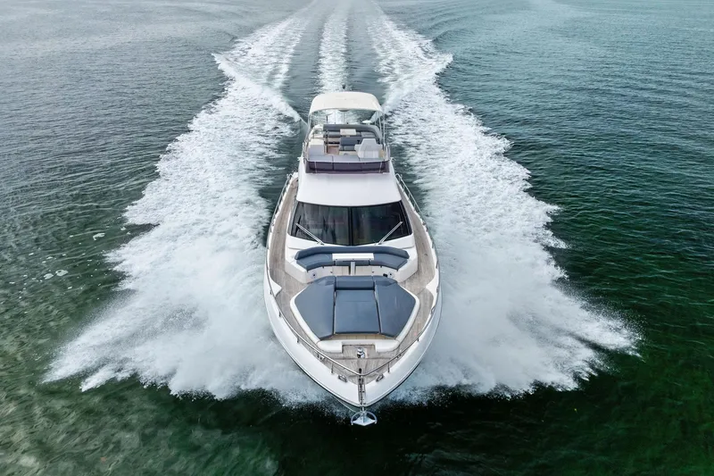 Slide: The Image of 2018 Ferretti Yachts 550 cruising on open water, aerial view. - 14