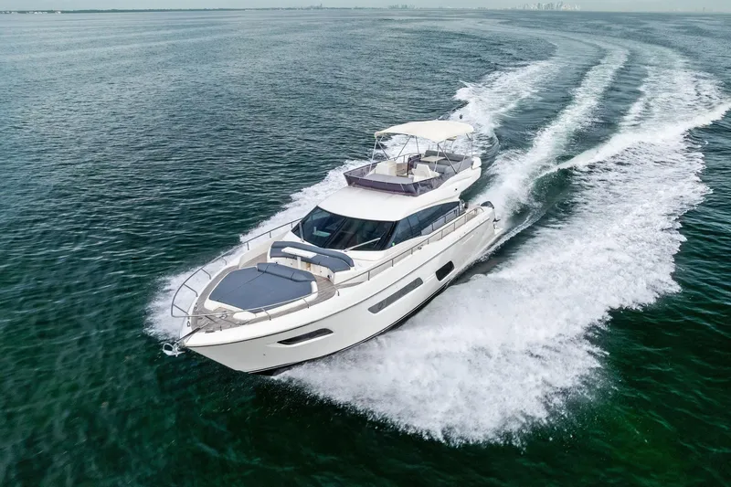 Slide: The Image of 2018 Ferretti Yachts 550 cruising on open water, showcasing sleek design and performance. - 15