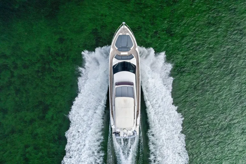 Slide: The Image of Aerial view of 2018 Ferretti Yachts 550 cruising on green water. - 21