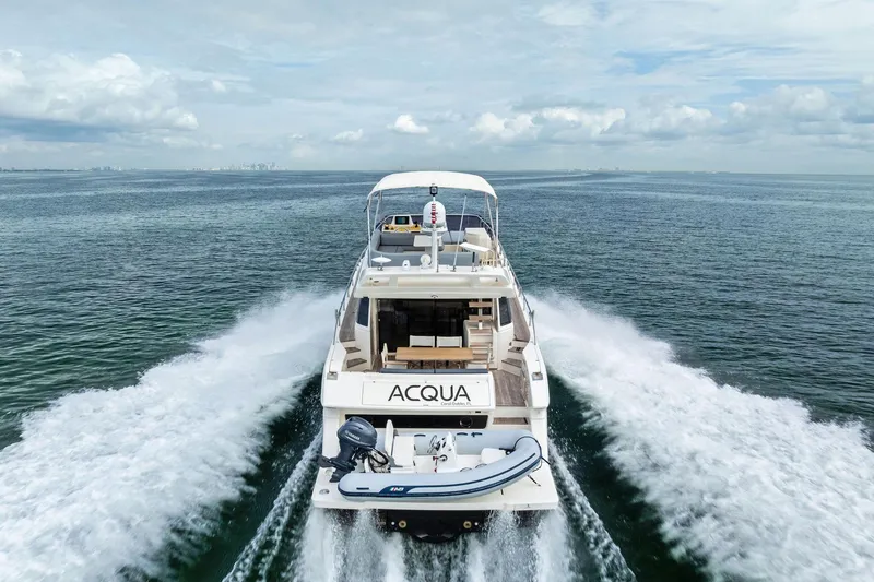 Slide: The Image of Ferretti Yachts 550, 2018 model, cruising on open sea with inflatable boat. - 22