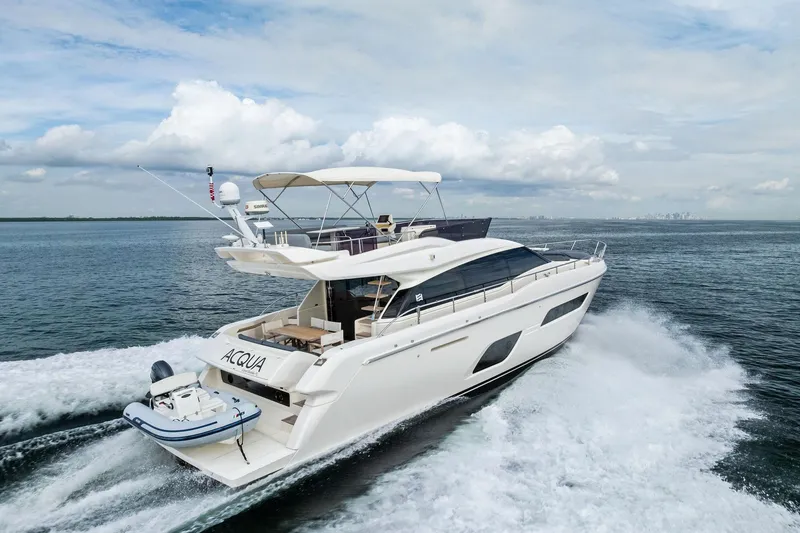 Slide: The Image of 2018 Ferretti Yachts 550 cruising on open water, showcasing sleek design and luxury. - 23