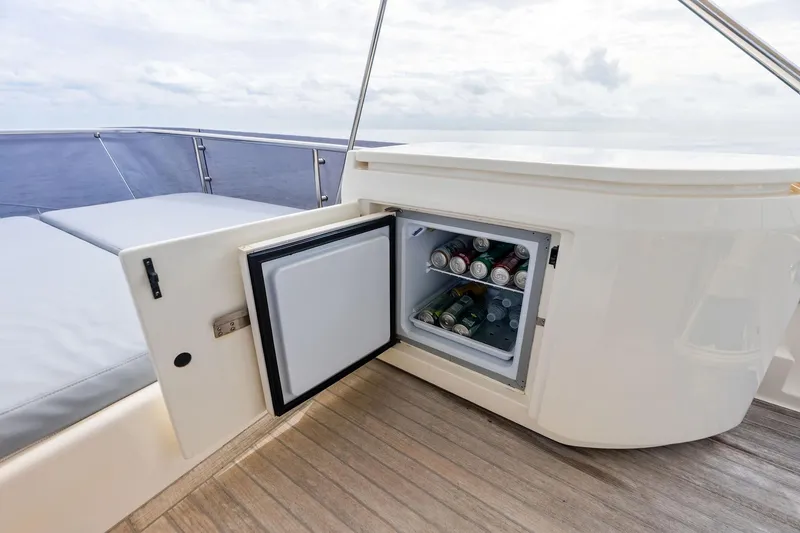 Slide: The Image of Open mini fridge on 2018 Ferretti Yachts 550, stocked with beverages on deck. - 51
