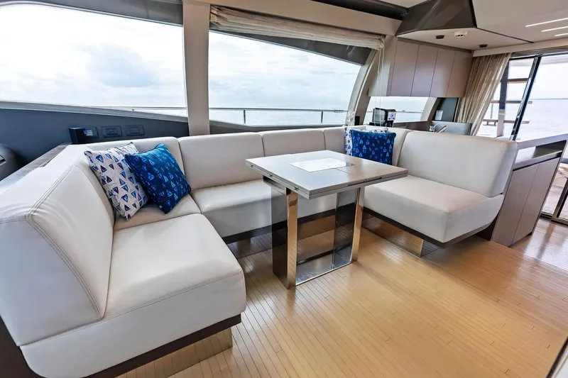 Slide: The Image of Luxurious interior of 2018 Ferretti Yachts 550 with modern seating and ocean view. - 56