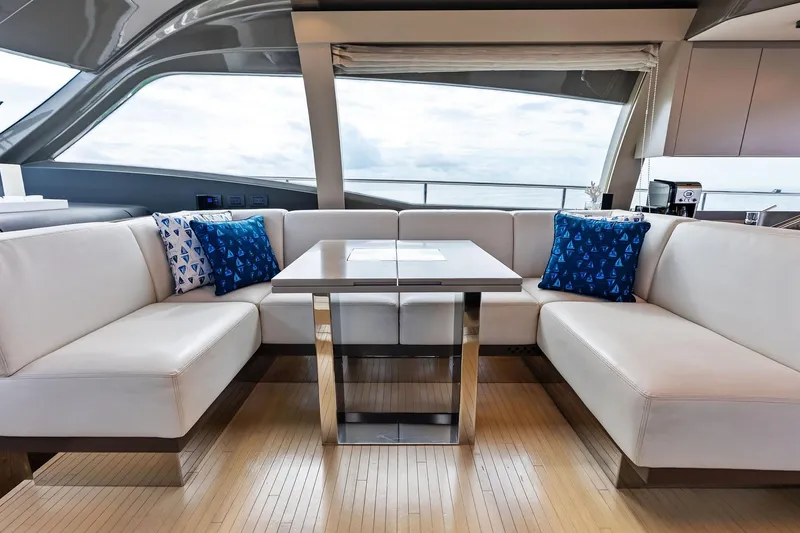 Slide: The Image of Luxurious interior of 2018 Ferretti Yachts 550 with elegant seating and ocean view. - 58