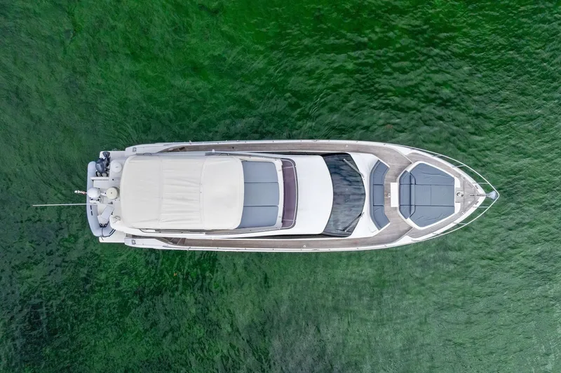 Slide: The Image of Aerial view of 2018 Ferretti Yachts 550 on green water. - 6