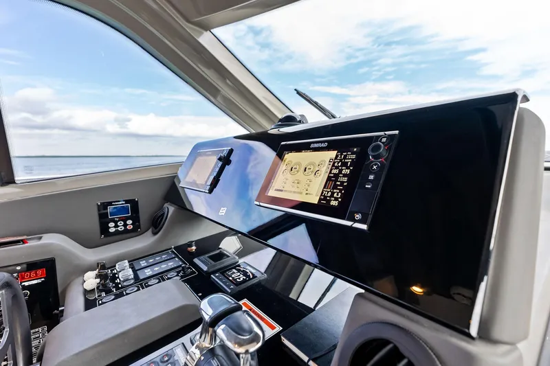 Slide: The Image of 2018 Ferretti Yachts 550 helm with advanced navigation system and controls. - 69