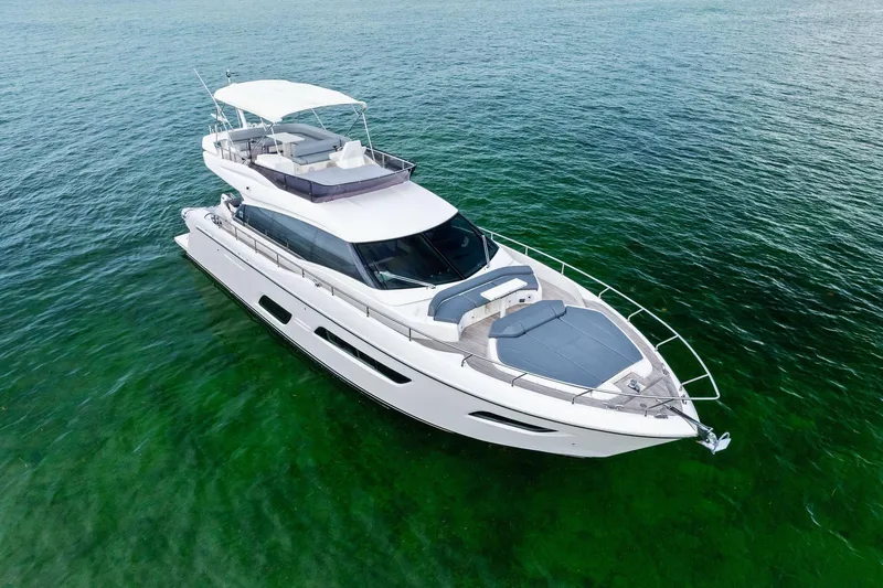Slide: The Image of 2018 Ferretti Yachts 550 cruising on clear green waters. - 7