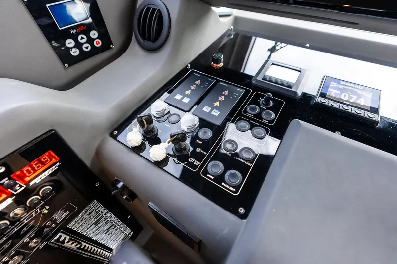 Slide: The Image of Control panel of a 2018 Ferretti Yachts 550, featuring navigation and system displays. - 71