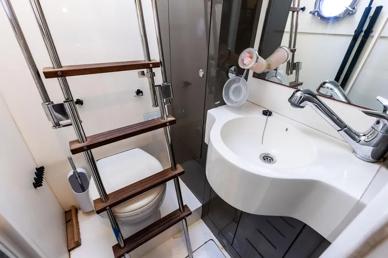 Slide: The Image of Bathroom interior of 2018 Ferretti Yachts 550, featuring compact sink and ladder. - 89