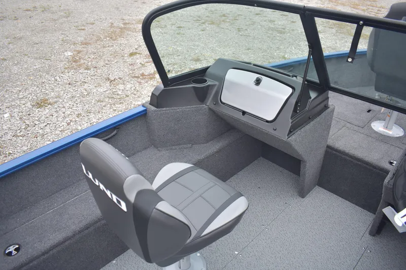 Slide: The Image of 2026 Lund 1650 Rebel XL Sport boat interior with seating and console. - 11