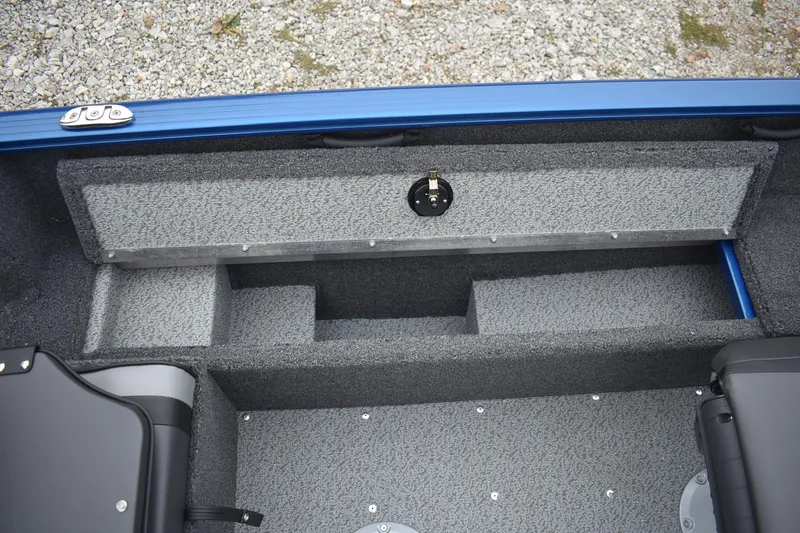 Slide: The Image of Interior view of 2026 Lund 1650 Rebel XL Sport boat, featuring storage compartments. - 14