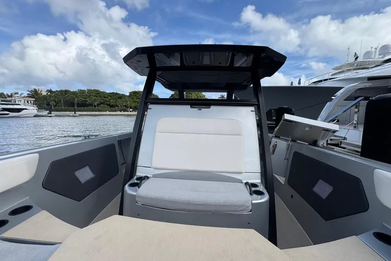 Slide: The Image of 2025 Wajer 38s luxury boat with triple Mercury engines on calm water. - 13