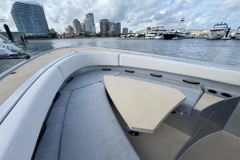 Slide: The Image of 2025 Wajer 38s luxury boat with triple outboard engines on calm water. - 14