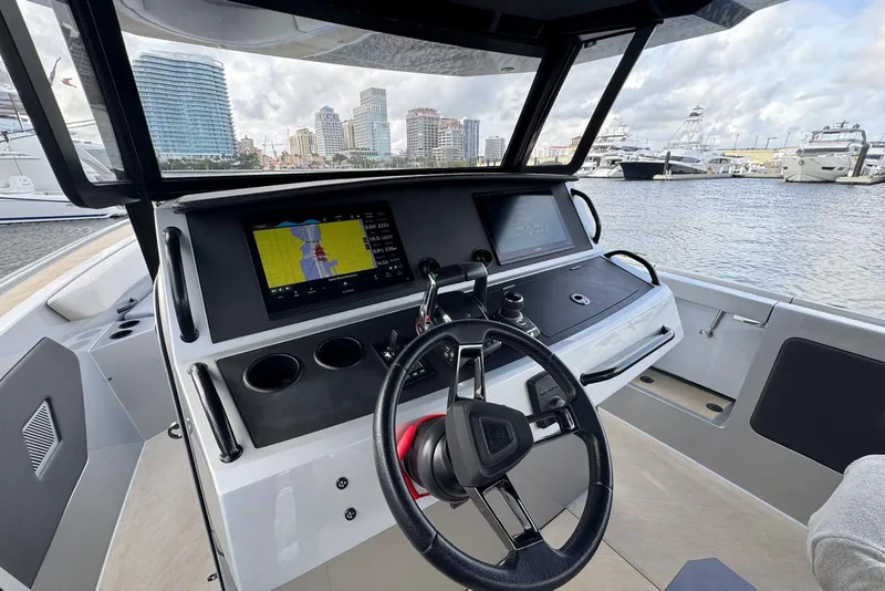 Slide: The Image of 2025 Wajer 38s luxury boat with triple outboard engines on water. - 16