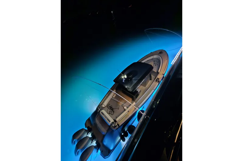 Slide: The Image of 2025 Wajer 38s boat cruising on calm water under a partly cloudy sky. - 2