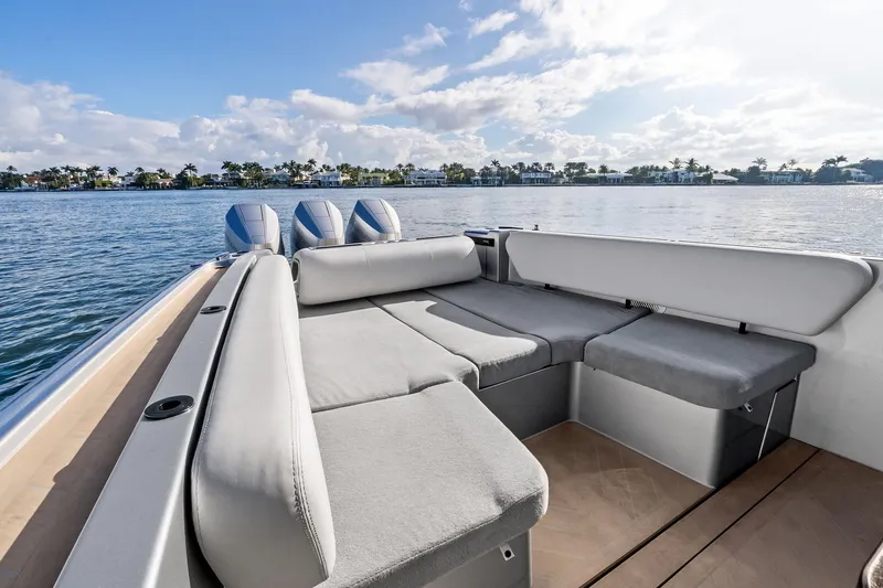 Slide: The Image of 2025 Wajer 38s luxury boat interior with spacious seating, overlooking serene water and distant shoreline. - 26