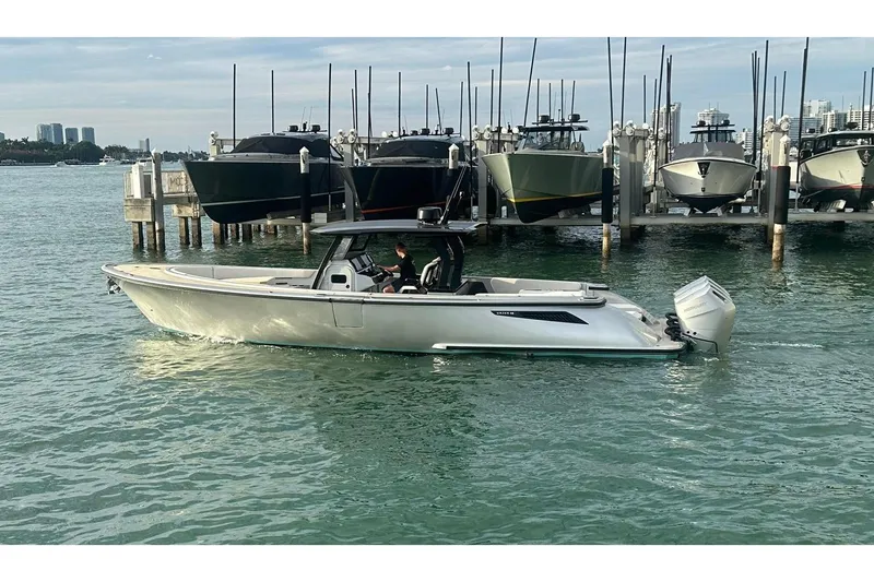 Slide: The Image of 2025 Wajer 38s boat cruising on calm water under a clear blue sky. - 3