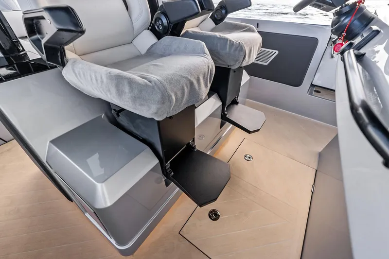 Slide: The Image of Interior of 2025 Wajer 38s boat with modern seating and controls. - 38