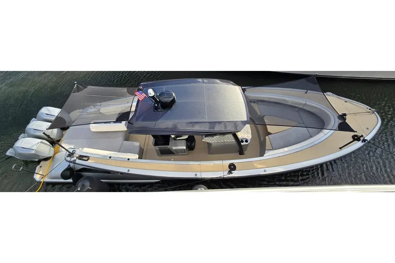 Slide: The Image of 2025 Wajer 38s luxury boat on calm water, palm trees in background. - 6