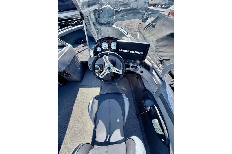 Slide: The Image of 2017 Crestliner 1850 SPORT FISH boat cockpit with steering wheel and Humminbird display. - 12