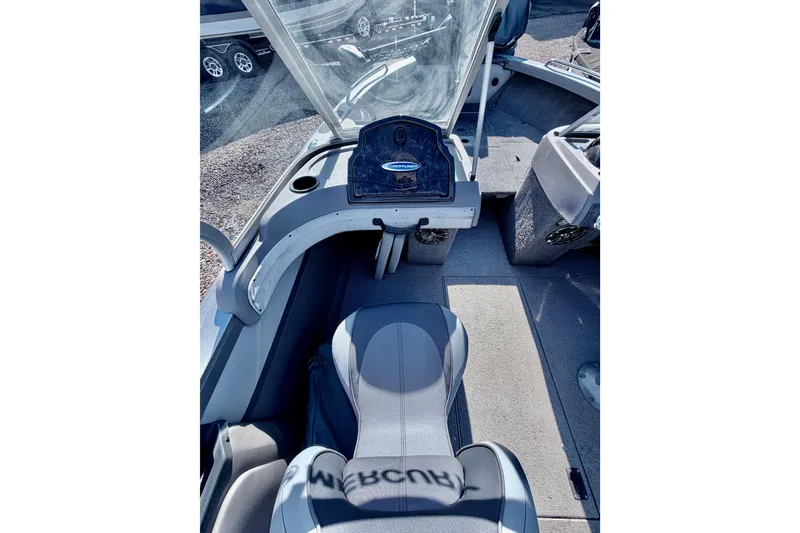 Slide: The Image of 2017 Crestliner 1850 Sport Fish boat interior with seating and dashboard view. - 14