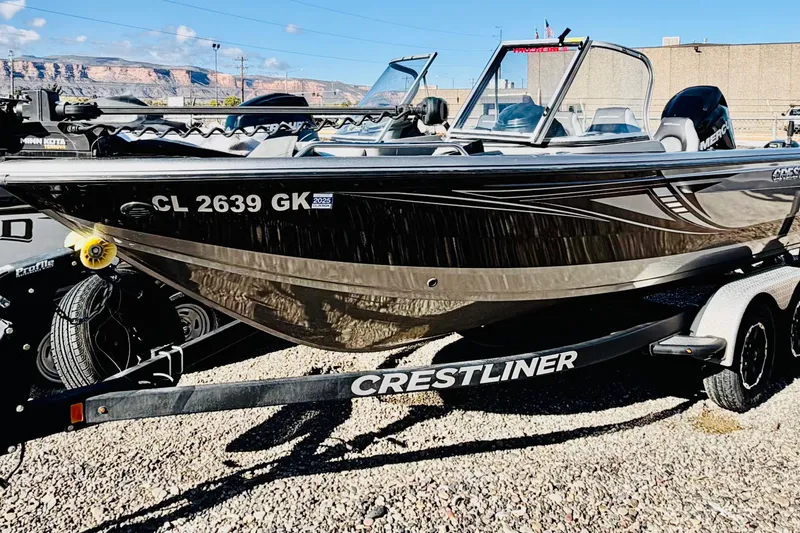 Slide: The Image of 2017 Crestliner 1850 Sport Fish boat on trailer, parked outdoors. - 6