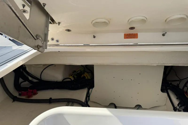 Slide: The Image of 2024 Chaparral 280 OSX boat storage compartment with wiring and ventilation. - 101