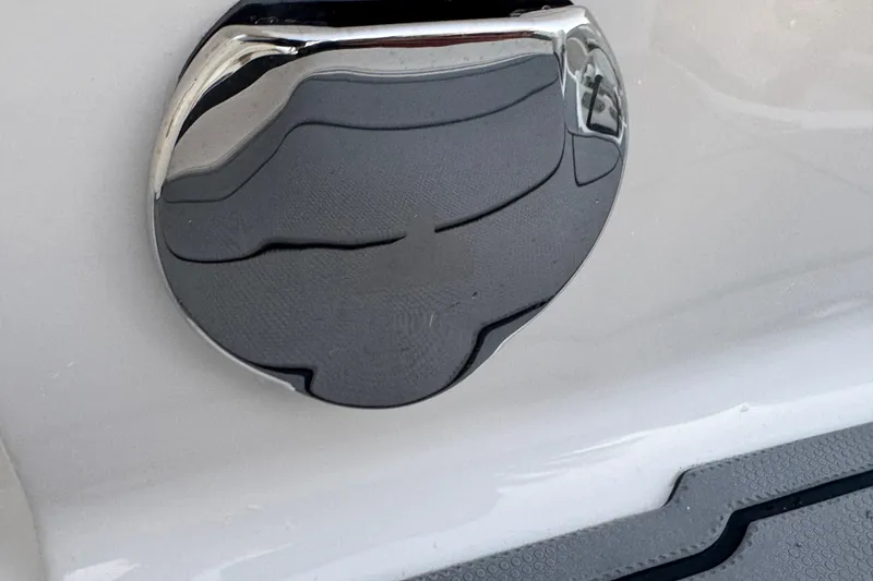 Slide: The Image of Chrome fuel cap on 2024 Chaparral 280 OSX boat, close-up view. - 102