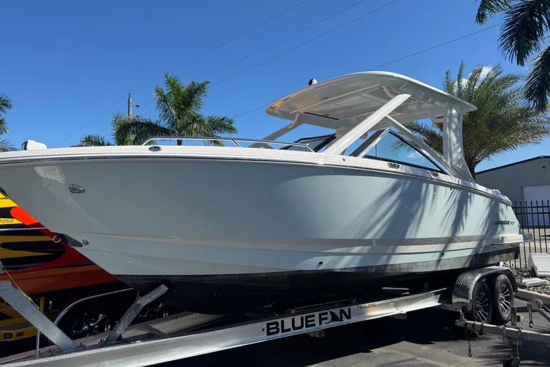 Slide: The Image of 2024 Chaparral 280 OSX emblem on sleek white surface. - 19