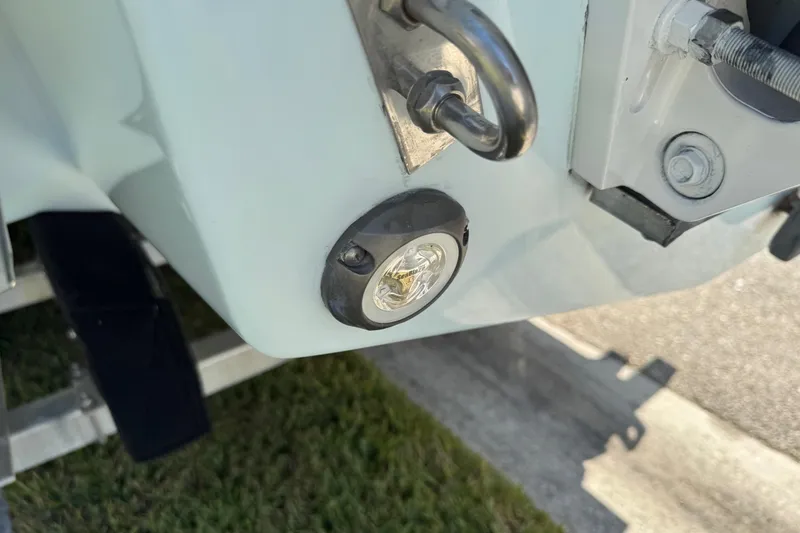 Slide: The Image of Close-up of 2024 Chaparral 280 OSX boat's rear light and hardware. - 24