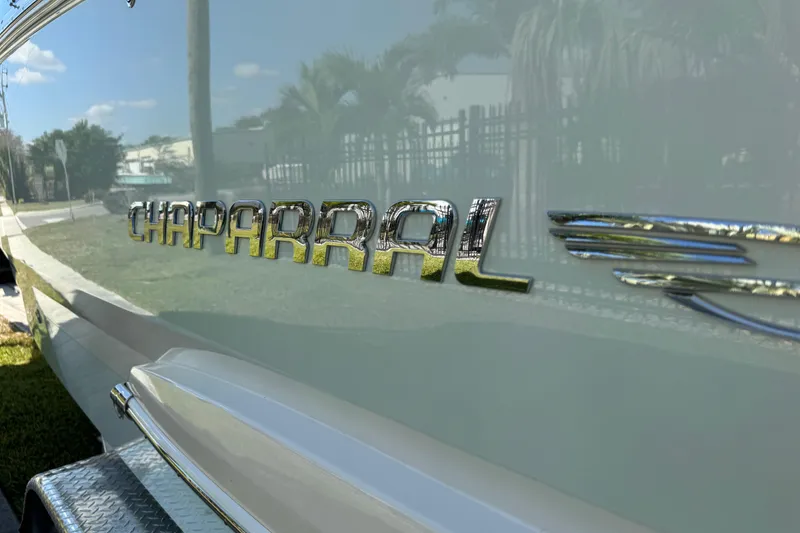 Slide: The Image of 2024 Chaparral 280 OSX boat logo with reflective chrome finish. - 28