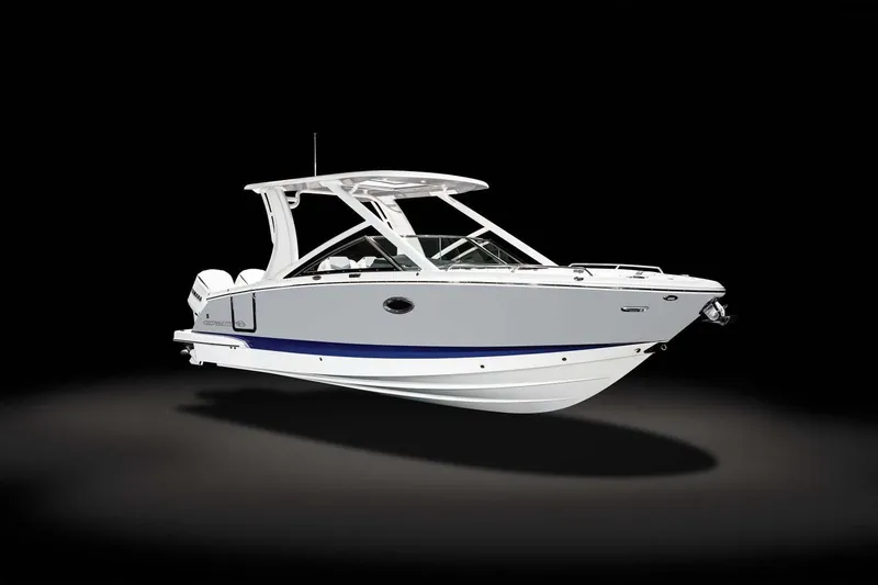 Slide: The Image of 2024 Chaparral 280 OSX boat with Yamaha engine, docked under palm trees. - 3