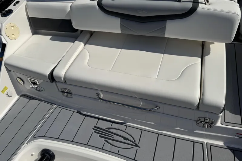 Slide: The Image of 2024 Chaparral 280 OSX boat seating area with sleek white upholstery and modern design. - 32