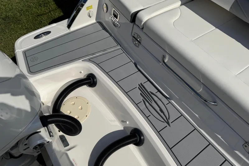 Slide: The Image of 2024 Chaparral 280 OSX boat interior with sleek seating and modern design elements. - 33