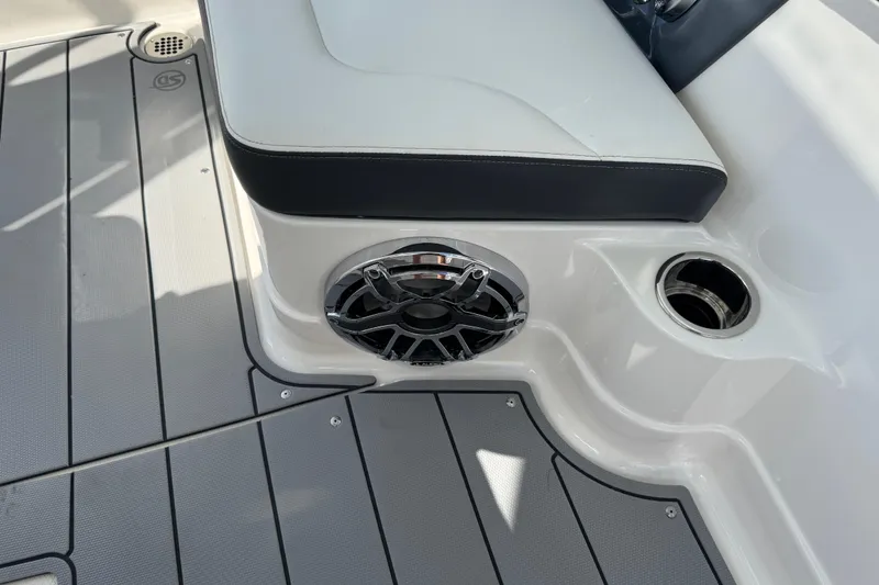 Slide: The Image of 2024 Chaparral 280 OSX boat interior with speaker and cup holder. - 36