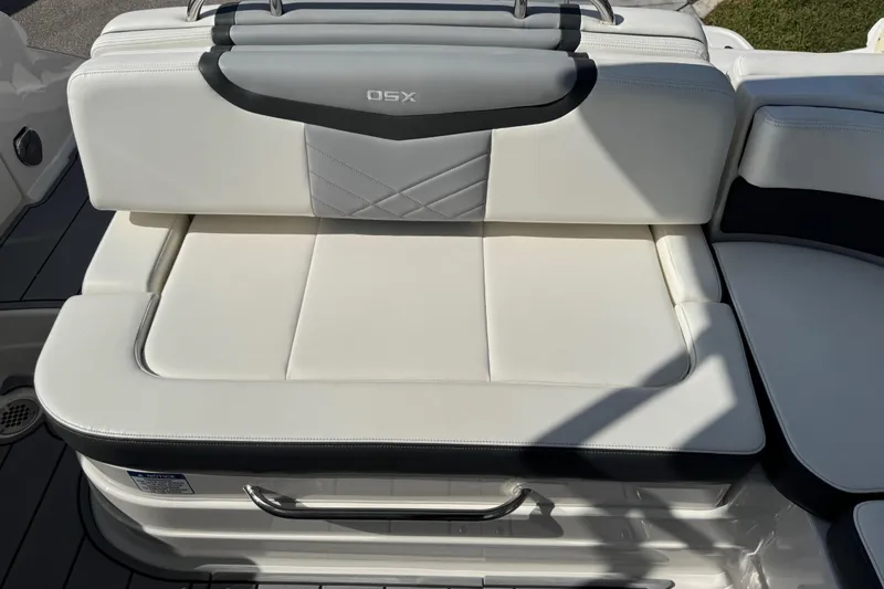 Slide: The Image of 2024 Chaparral 280 OSX boat seat with white upholstery and sleek design. - 39