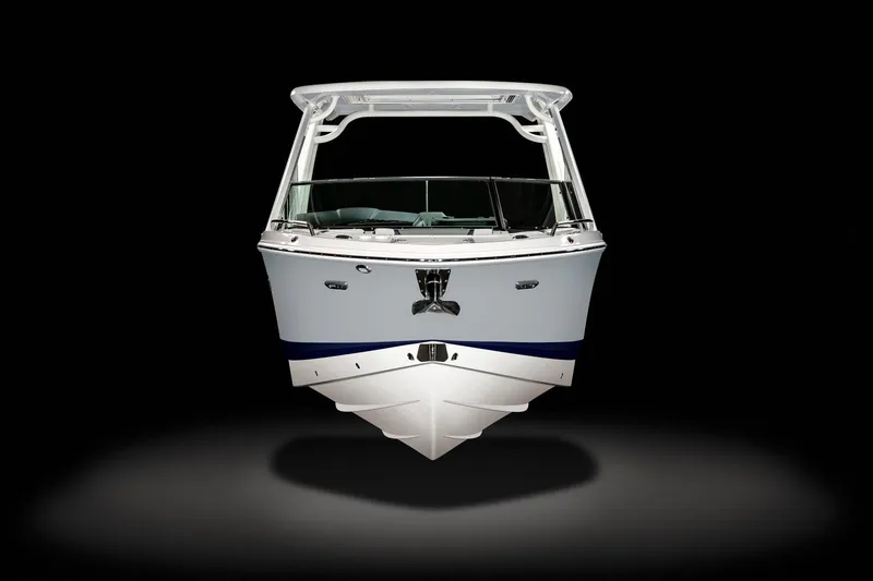 Slide: The Image of 2024 Chaparral 280 OSX boat on trailer under blue sky. - 4