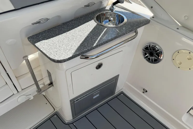 Slide: The Image of 2024 Chaparral 280 OSX boat interior with sink and countertop. - 40
