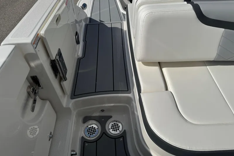 Slide: The Image of 2024 Chaparral 280 OSX boat interior with sleek seating and modern design elements. - 43