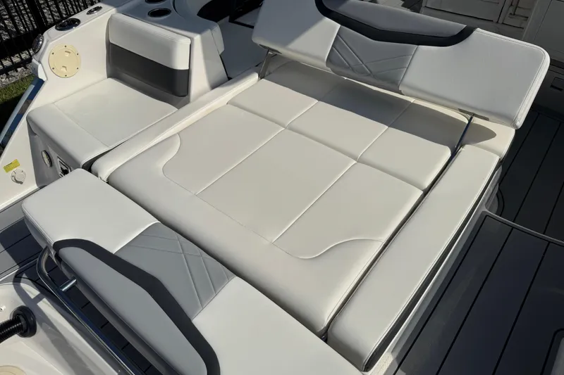 Slide: The Image of 2024 Chaparral 280 OSX boat with luxurious white seating and sleek design. - 44