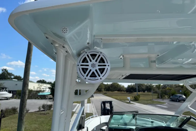 Slide: The Image of 2024 Chaparral 280 OSX boat with JL Audio speaker on the deck. - 49