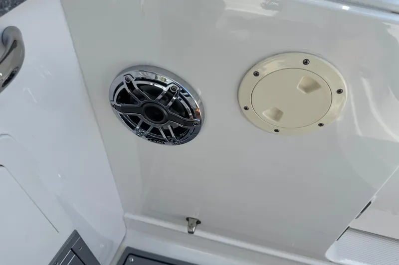 Slide: The Image of 2024 Chaparral 280 OSX boat speaker and access panel detail. - 51