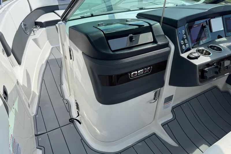 Slide: The Image of 2024 Chaparral 280 OSX boat interior with modern dashboard and seating. - 54
