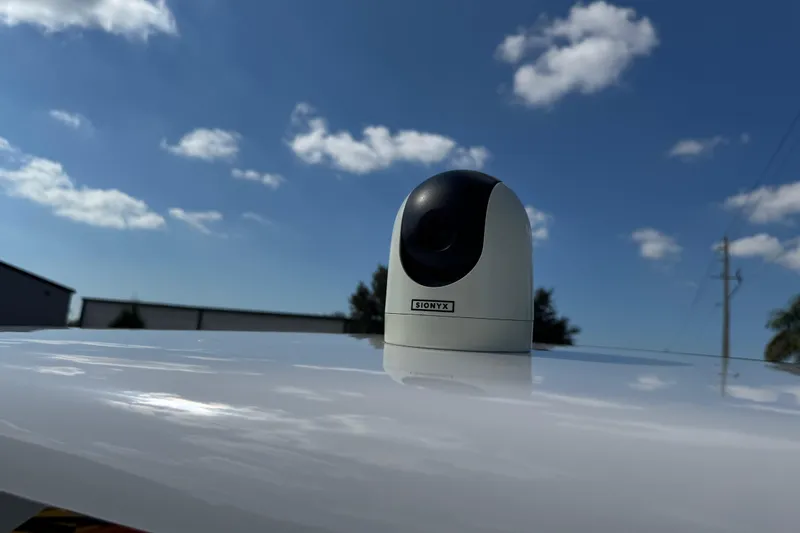 Slide: The Image of Rooftop camera on 2024 Chaparral 280 OSX under clear blue sky. - 57