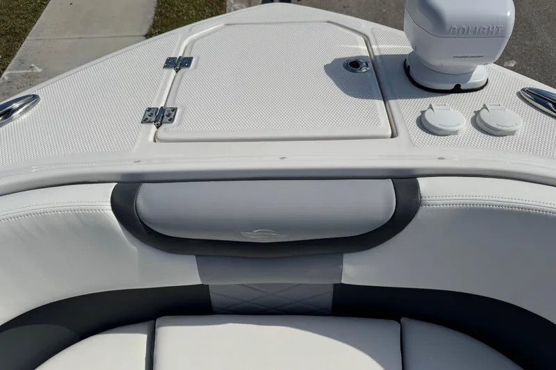 Slide: The Image of 2024 Chaparral 280 OSX boat interior with white seating and Golight spotlight. - 59