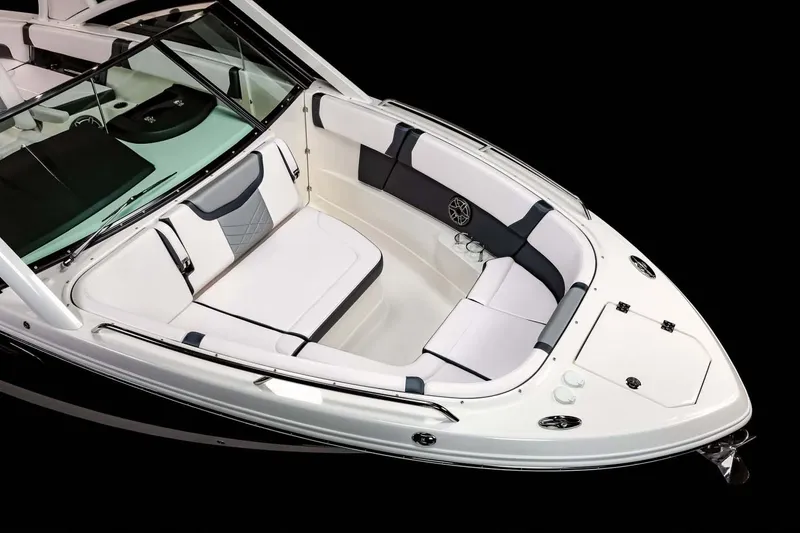 Slide: The Image of 2024 Chaparral 280 OSX boat on trailer, parked with palm trees in the background. - 7