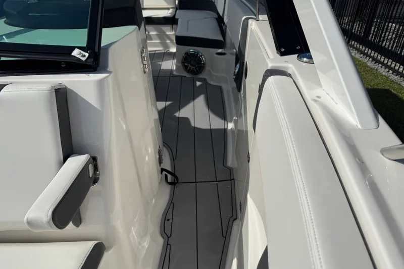 Slide: The Image of 2024 Chaparral 280 OSX boat interior with sleek seating and modern design. - 70