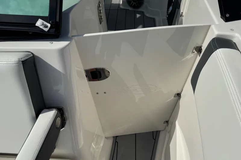 Slide: The Image of 2024 Chaparral 280 OSX boat interior, featuring sleek white seating and modern design elements. - 71