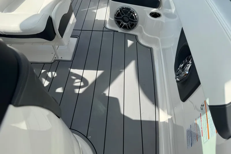 Slide: The Image of 2024 Chaparral 280 OSX boat interior with sleek seating and modern flooring design. - 72